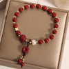 Cinnabar Peace Buckle Bracelet with Clover Charm