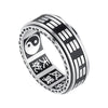 Silver titanium steel ring with rotating Bagua trigrams and Yin Yang symbol on a dark background