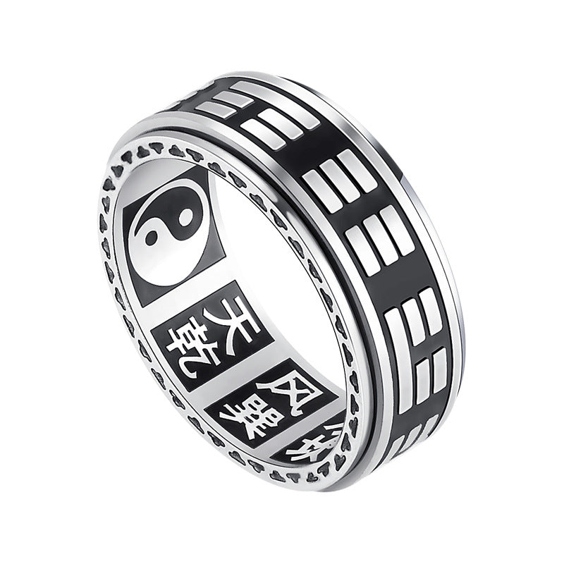 Silver titanium steel ring with rotating Bagua trigrams and Yin Yang symbol on a dark background