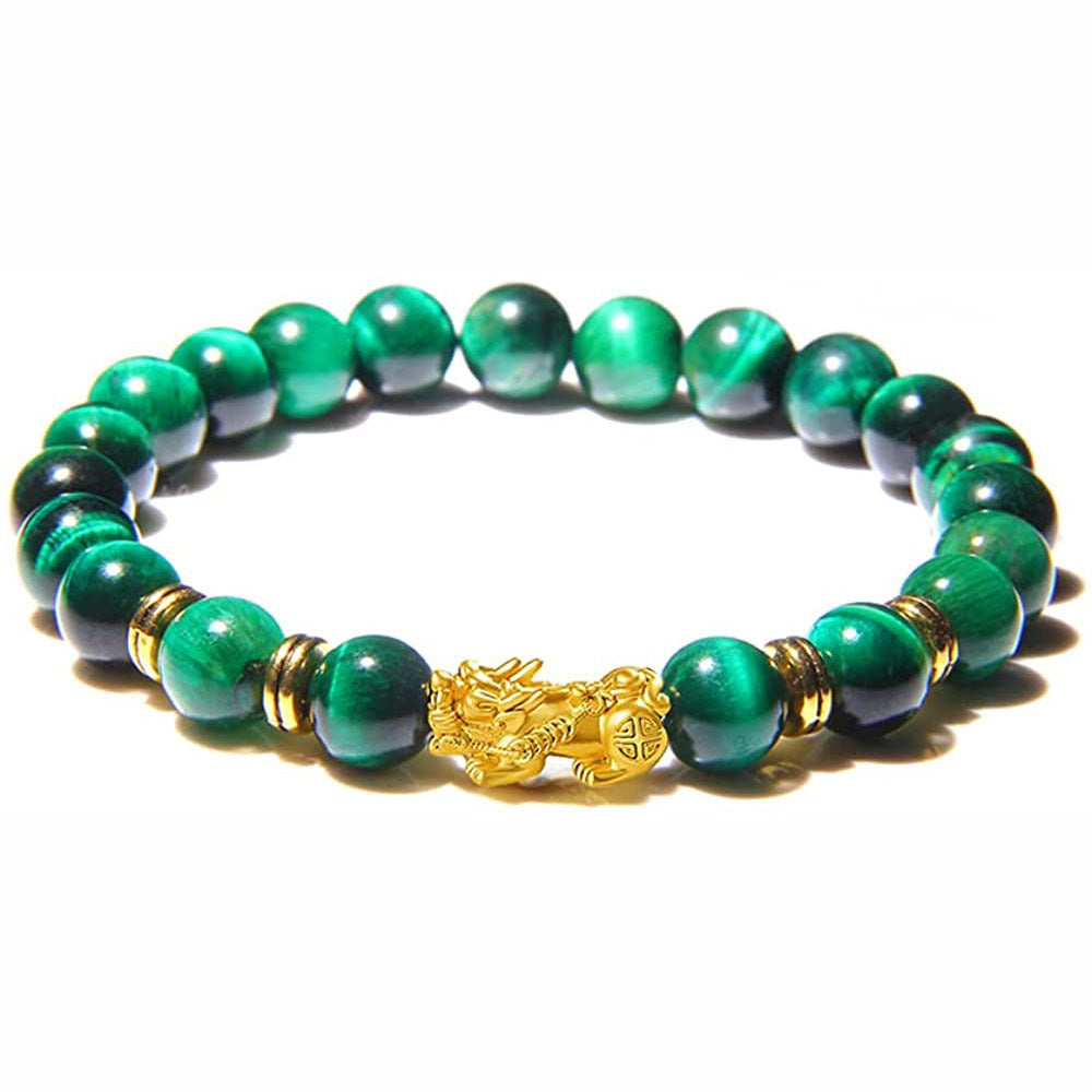Green tiger eye beaded bracelet with gold pixiu charm on white background