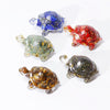 Small crystal resin turtle decoration statue with gold foil on a white background