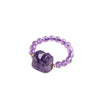 Close up of a purple amethyst beaded ring with a carved Pixiu charm