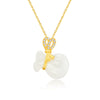 Close up of a white jade money bag pendant on a gold chain