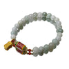 Jade beaded bracelet with red prayer wheel and gold charm
