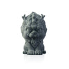 Small green sandstone Pixiu statue sitting on a stone surface outdoors