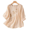 Beige embroidered flower crew neck women's half sleeve shirt on wooden hanger