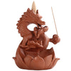 White ceramic incense burner with a dragon coiled over a lotus flower