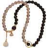 Double wrap bracelet with gray agate and gold sheen obsidian beads featuring a lotus charm