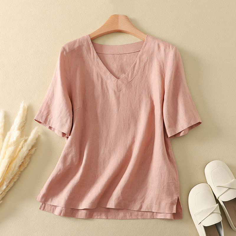 Back view of a white women's cotton linen V-neck T-shirt on a wooden hanger