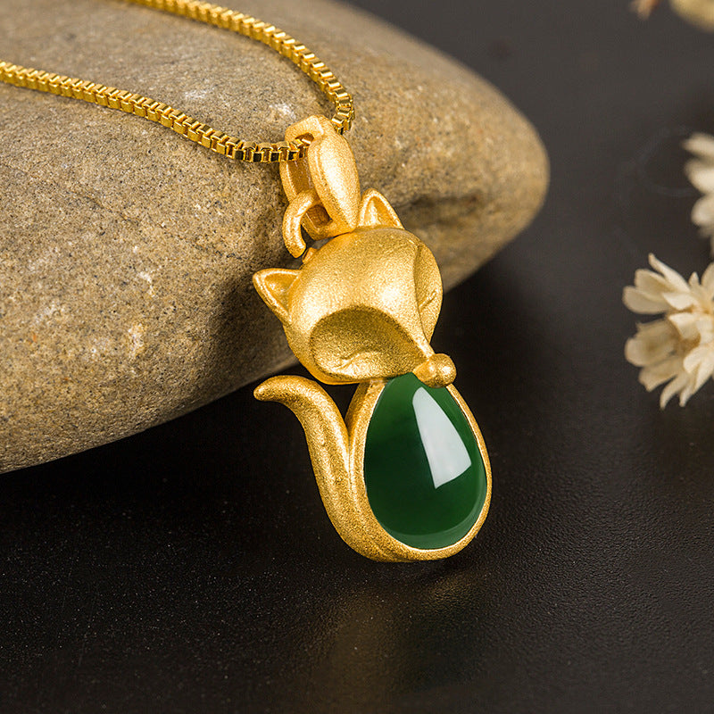 Gold tone copper fox pendant with green chalcedony stone on a box chain