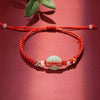 Woven Cord Bracelet with Lotus or Peace Buckle