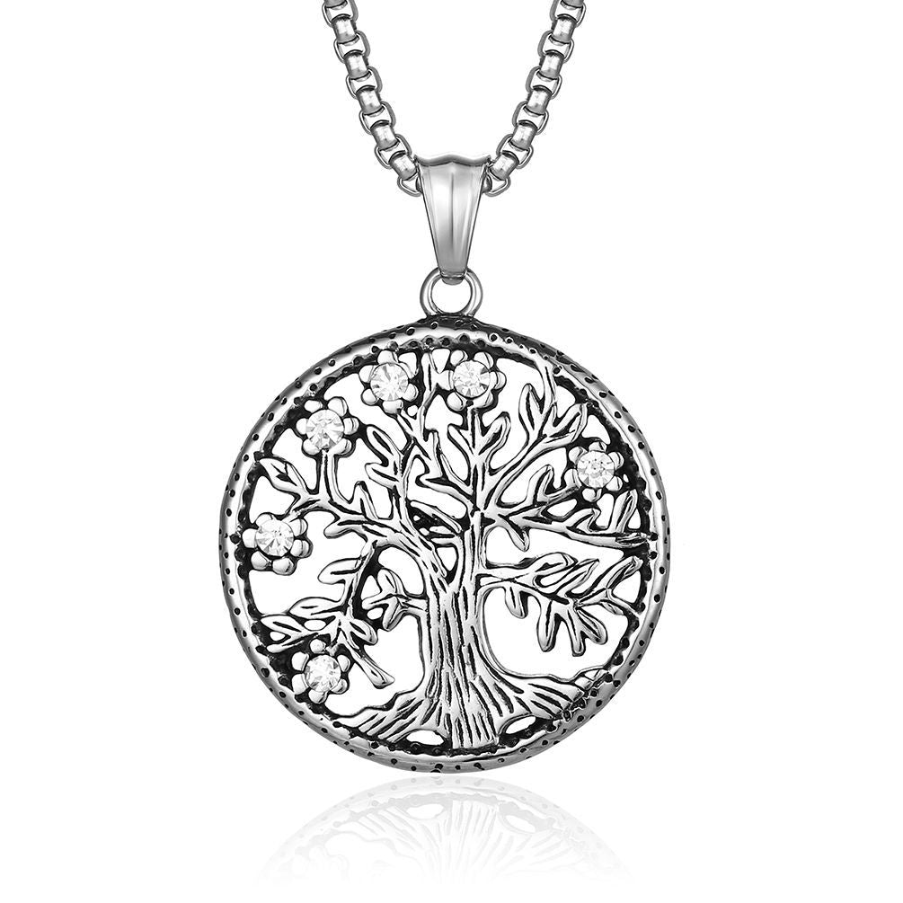 Silver-tone round pendant with a tree design on a chain