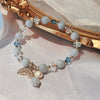 Crystal and Cat's Eye Charm Bracelet with Star, Moon and Flower Beads