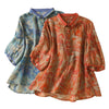 Two women's vintage floral cotton shirts in orange and blue displayed flat