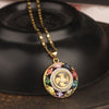 Gold-tone copper pendant with colorful zircons and spinning center