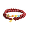 Double-wrap red cinnabar bracelet with Pixiu charm and colorful accent beads on white background