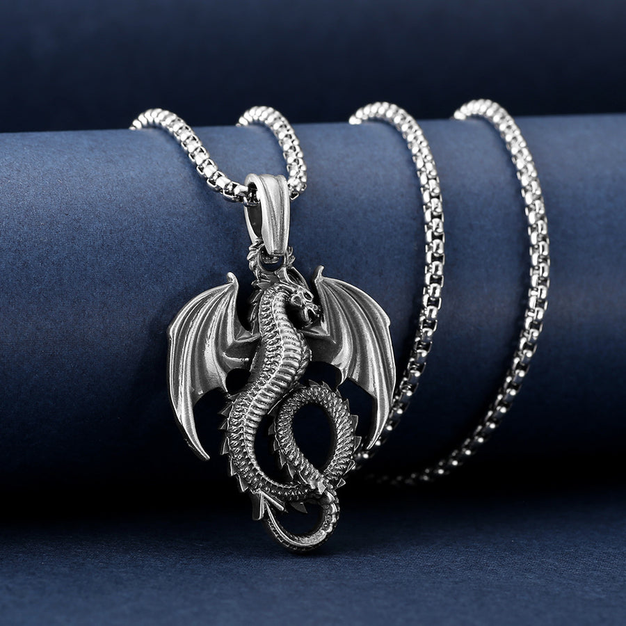 Silver-tone dragon pendant necklace with wings spread on a box chain