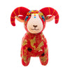 A group of red patterned plush goat toys sitting on a table