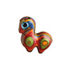 Close up of a small multi-colored wooden horse figurine with blue eyes