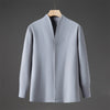 Front view of a light blue men's long sleeve shirt with a stand collar on a hanger