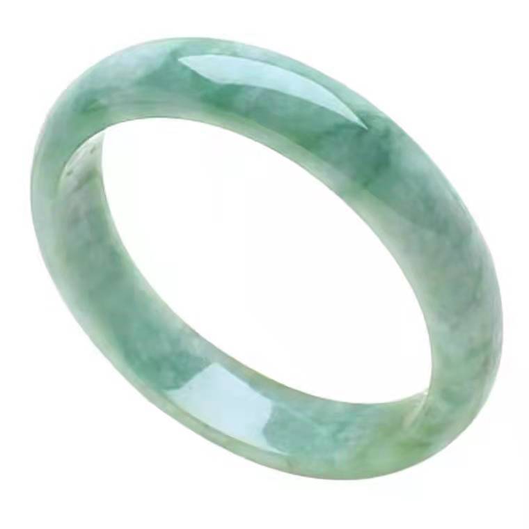Smooth light green jade bangle bracelet on a dark display stand