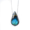 Three natural labradorite water drop pendants on silver chains showing blue flash
