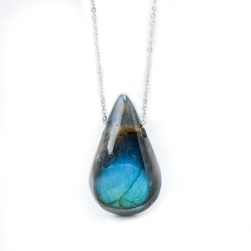 Three natural labradorite water drop pendants on silver chains showing blue flash
