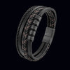 Close-up of a multi-layer braided leather bracelet with a magnetic clasp