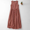 Red and white plaid sleeveless midi dress with pockets laid flat on a white background