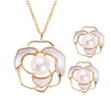 Gold-tone sterling silver camellia necklace and earrings with white pearls
