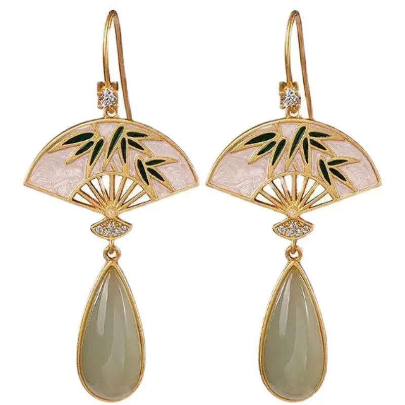 Gold-tone fan earrings with green bamboo leaves and a jade-colored teardrop drop