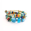 Close up of a green multilayer agate bead wrap bracelet on white background