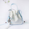 Embroidered Canvas Crossbody Bag with Tassels