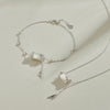 Sterling silver necklace and bracelet set with white jade bamboo charms