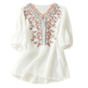 White cotton linen t-shirt with floral embroidery on the chest