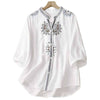 White cotton linen shirt with floral embroidery on the chest and shoulders