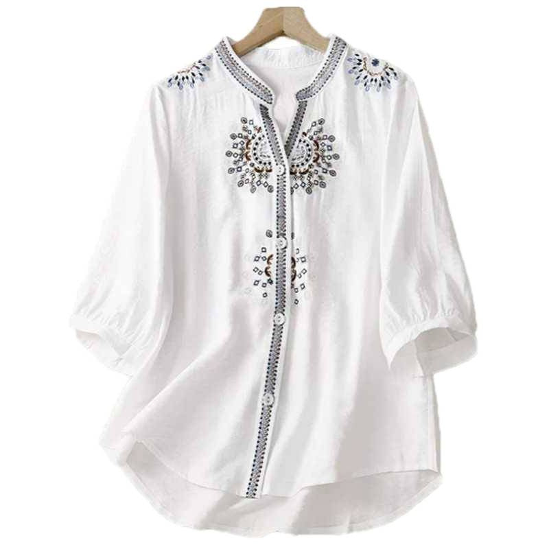 White cotton linen shirt with floral embroidery on the chest and shoulders