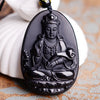 Close up of a black obsidian carved pendant necklace
