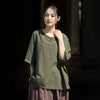 Woman wearing a relaxed green half sleeve t-shirt with a round neck