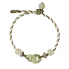 Close up of a green jade bracelet with interlocking rings on a braided cord