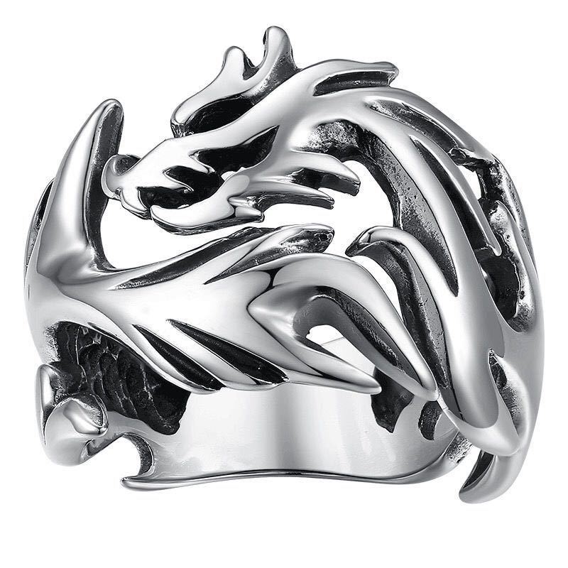 A silver-tone adjustable ring with a detailed dragon and flame design.