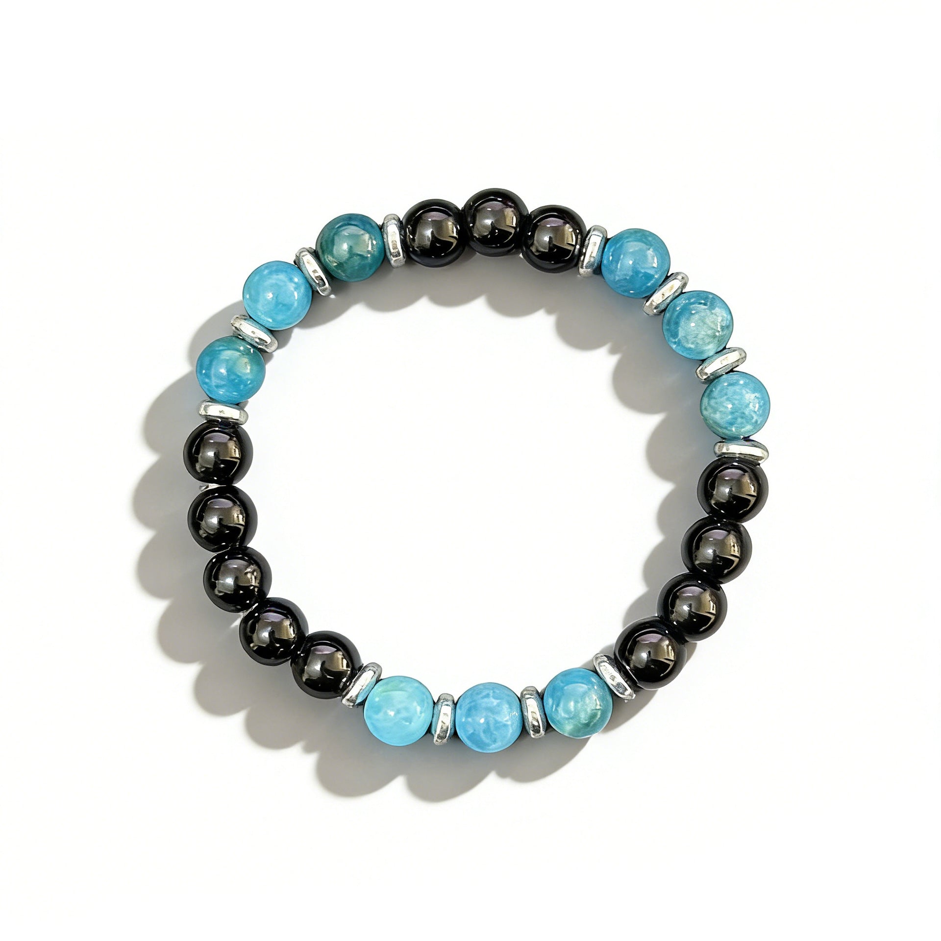 A beaded bracelet featuring blue and black natural stones with silver spacers on a white background