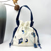 Embroidered Drawstring Bucket Bag with Tassel, Floral and Animal Motifs