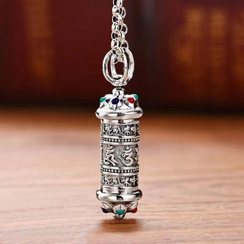 Silver tone copper cylinder pendant with engraved mantras and colorful stones
