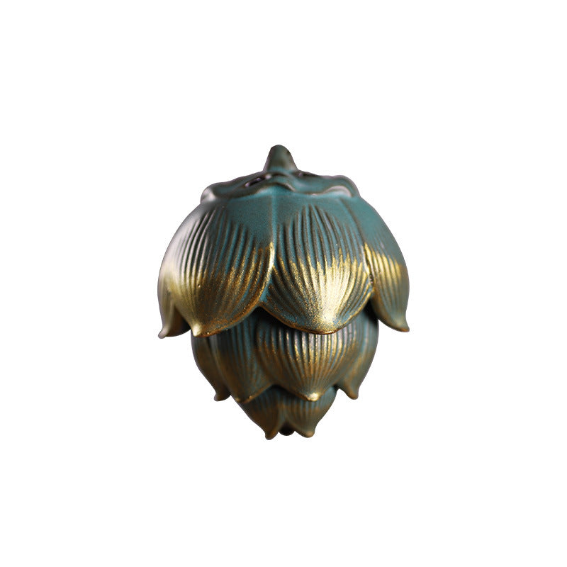Teal and gold ceramic lotus incense burner shown open and closed