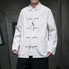 Man wearing a white long sleeve traditional Chinese style jacket with frog buttons