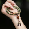 Green Sandalwood Bracelet with Hand-Tied Knots and Bead Tassels