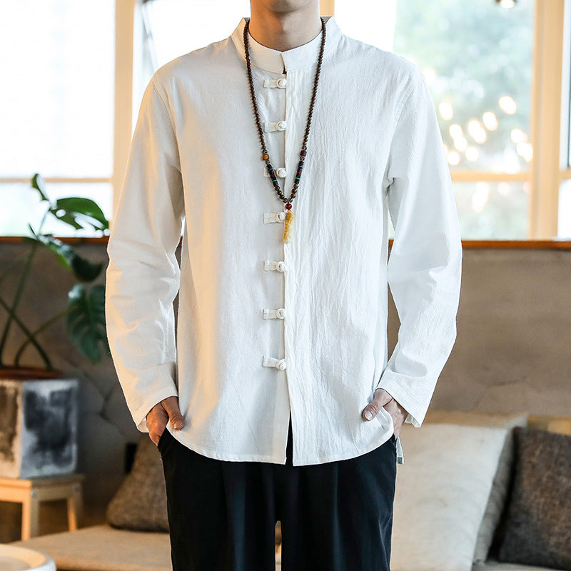 Man wearing a white long sleeve linen shirt with traditional knot buttons