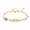 Sterling silver bracelet with white jade bamboo beads and pearl on a wrist