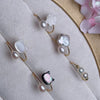 Gold tone open ring with white pearl and shell cat head on grey display stand